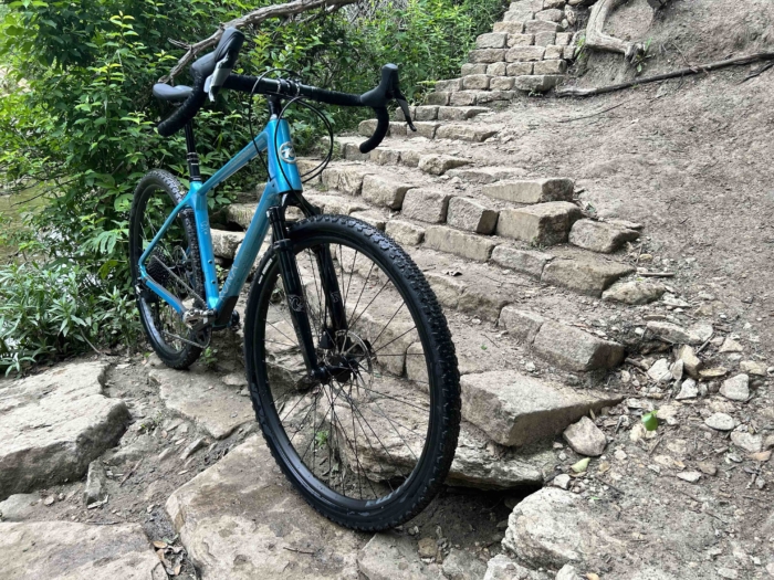 Kona Ouroboros standing on a trail. Front side view.