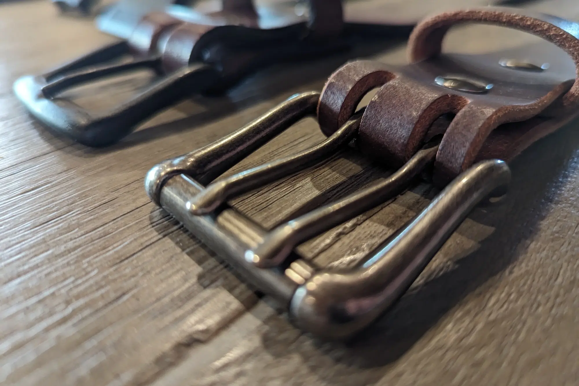 Close up of the metal buckle on the Nohma Leather Belt