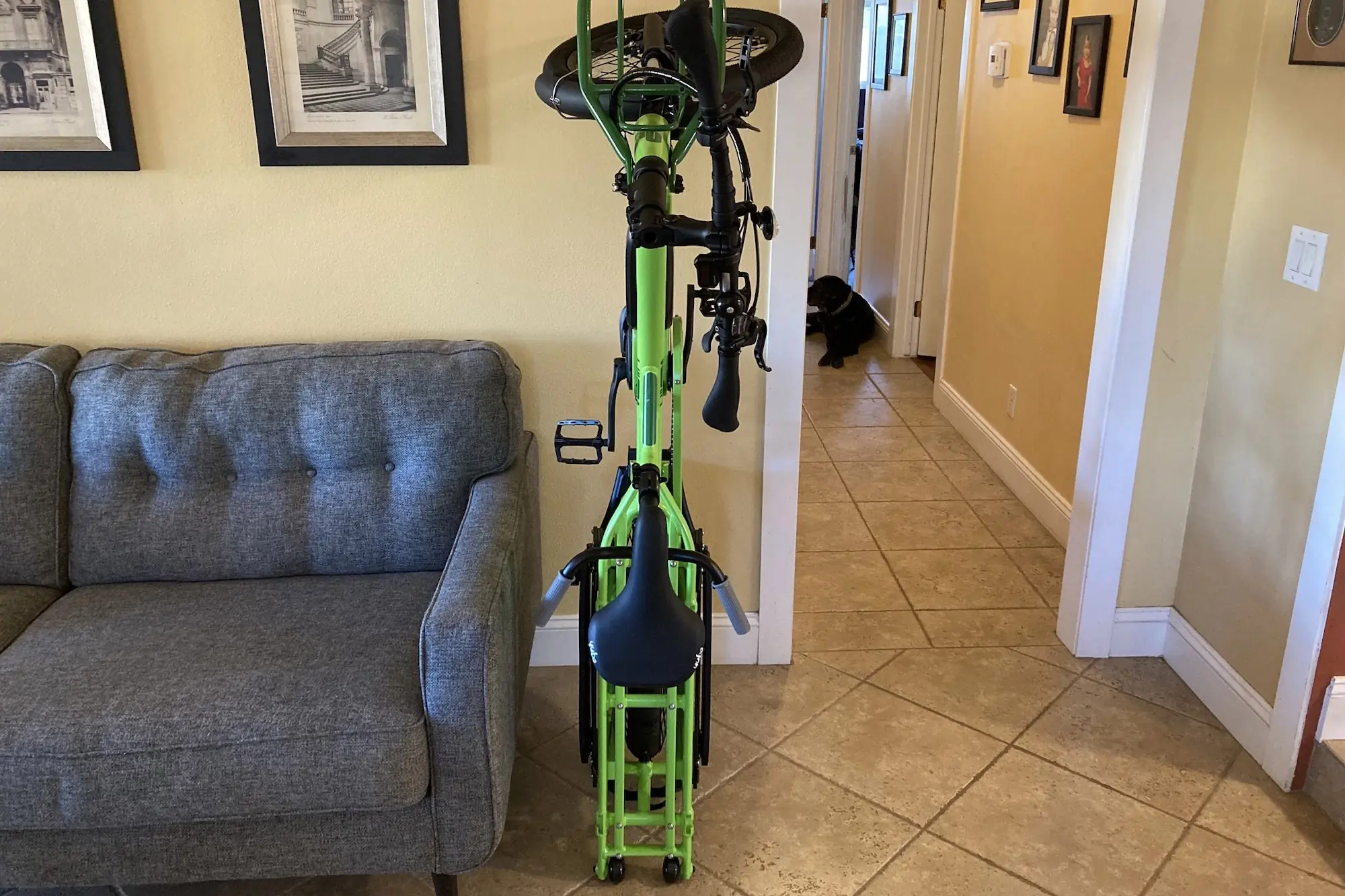 The Yuba FastRack electric cargo bike can be tipped on its tail to stand upright for storage