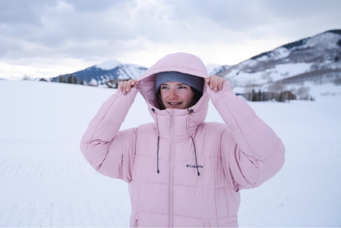 woman pulling on the Pike Lake II's hood 