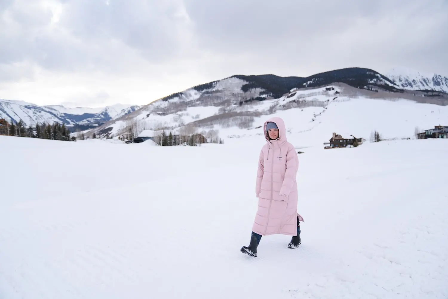 woman walking outside on a snowy landscape in the Columbia Pike Lake II Long
