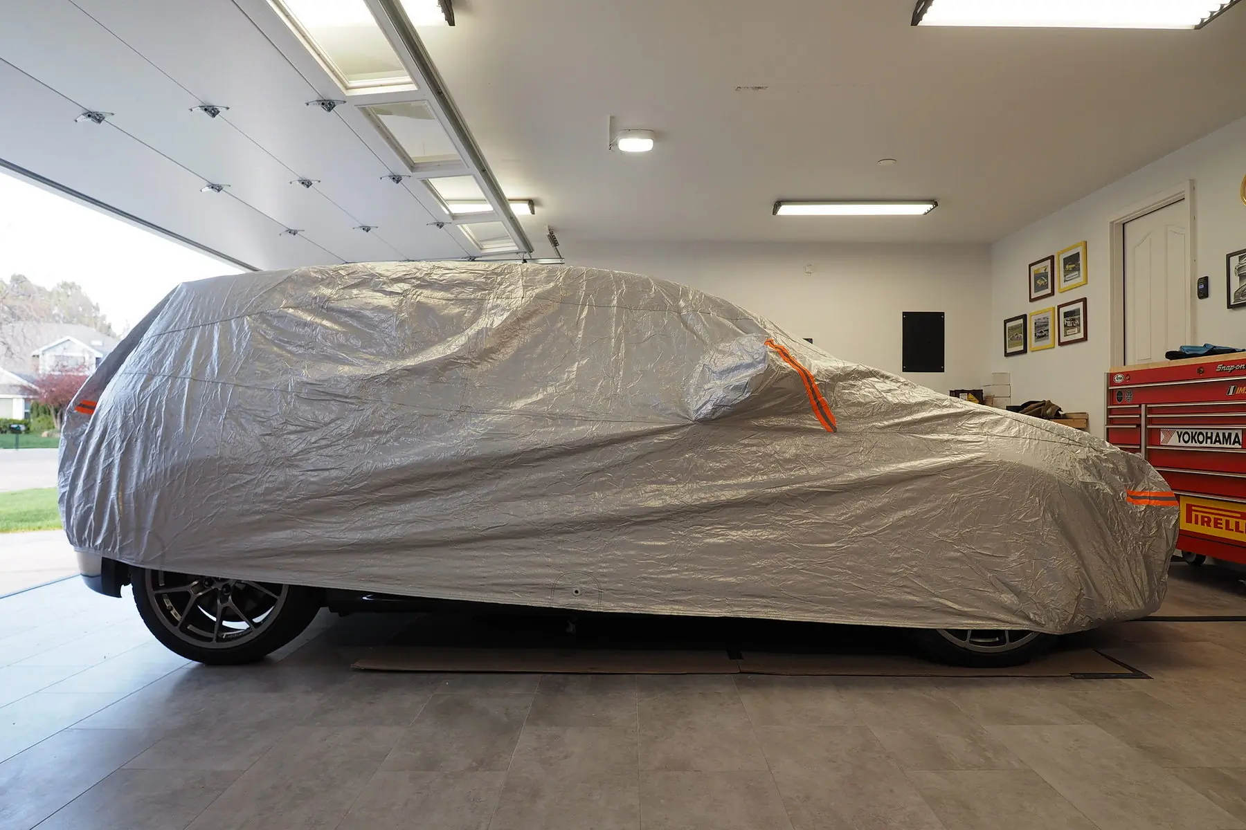 car cover on vehicle in a garage