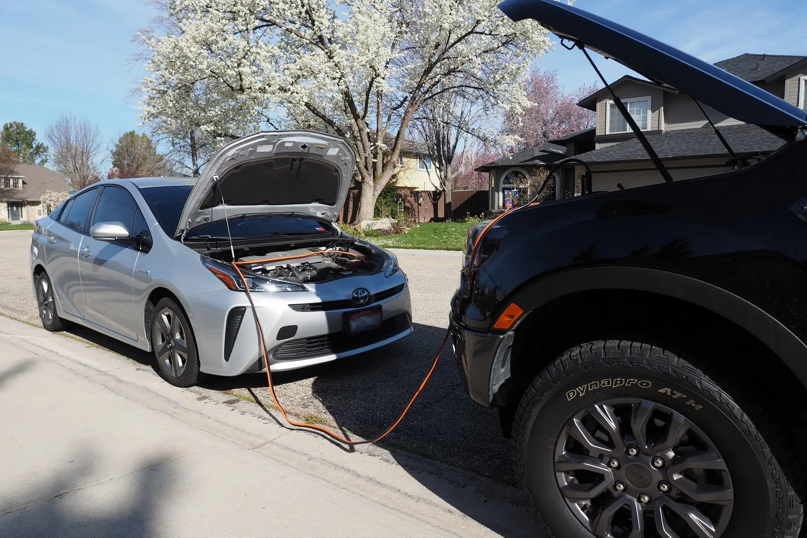 one vehicle jumping another's battery