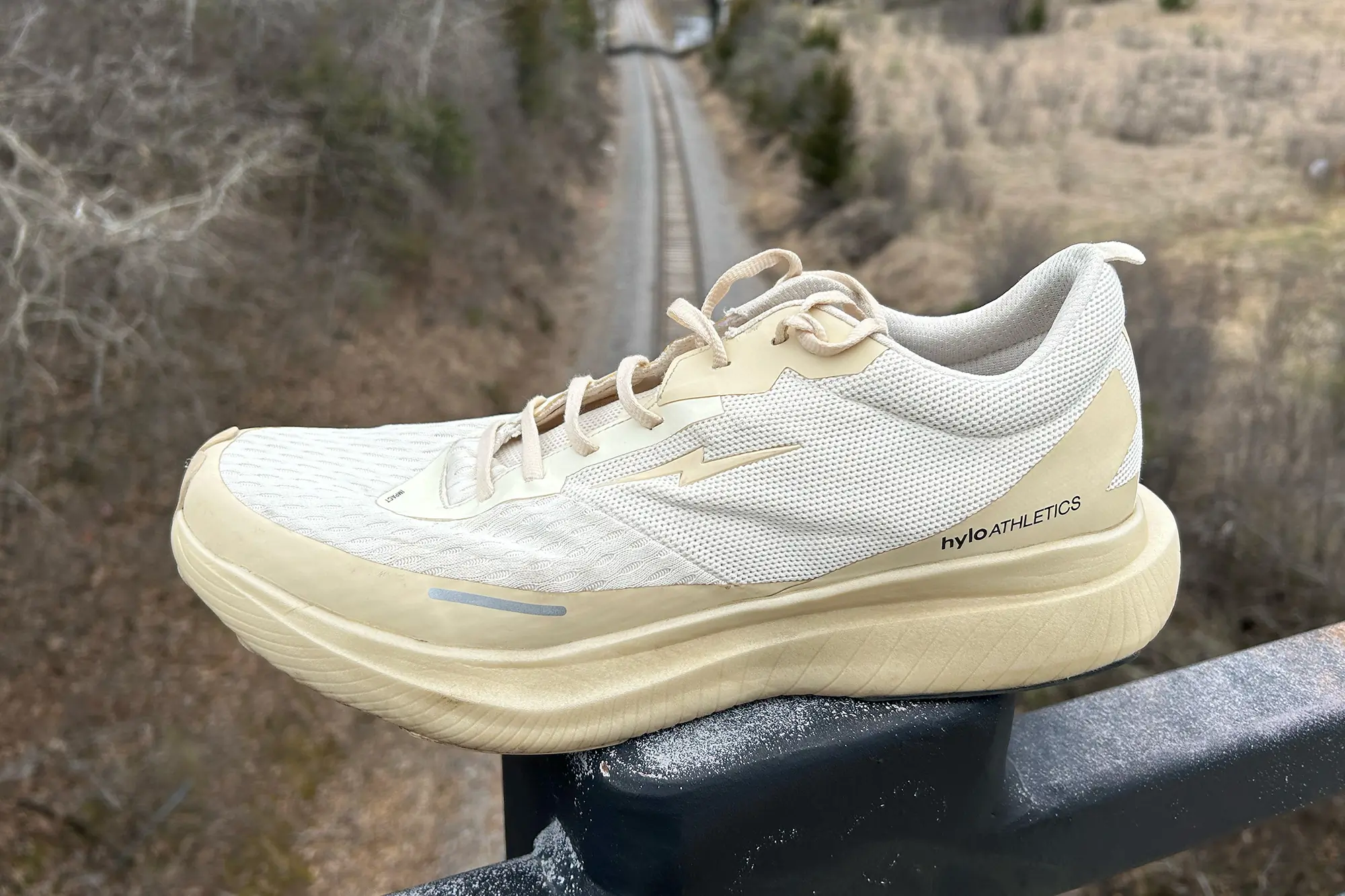 Hylo Impact running shoe over railroad tracks