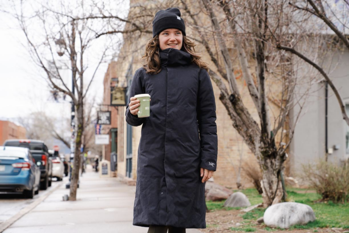 woman wearing winter jacket on a city street