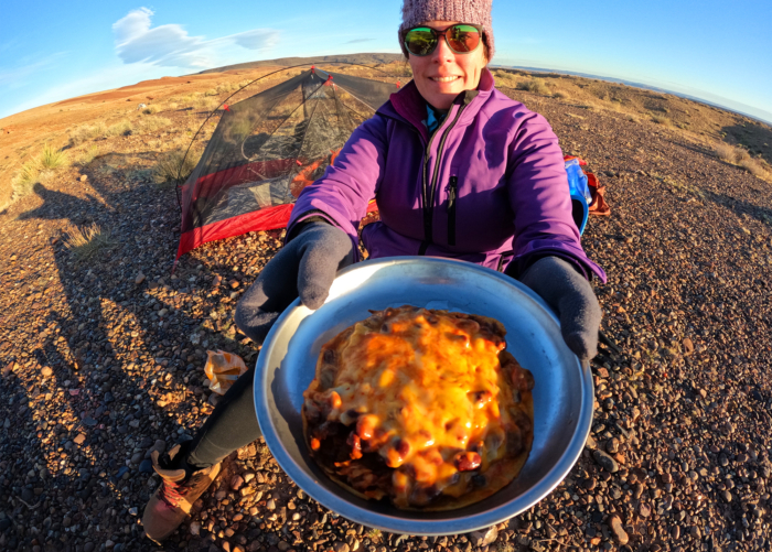 person holding prepared gluten free meal in the bowl