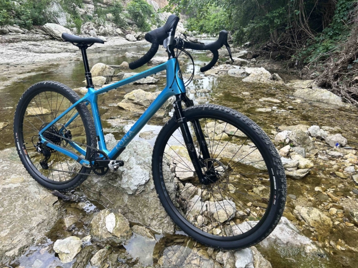 Kona Ouroboros standing in a creek bed.