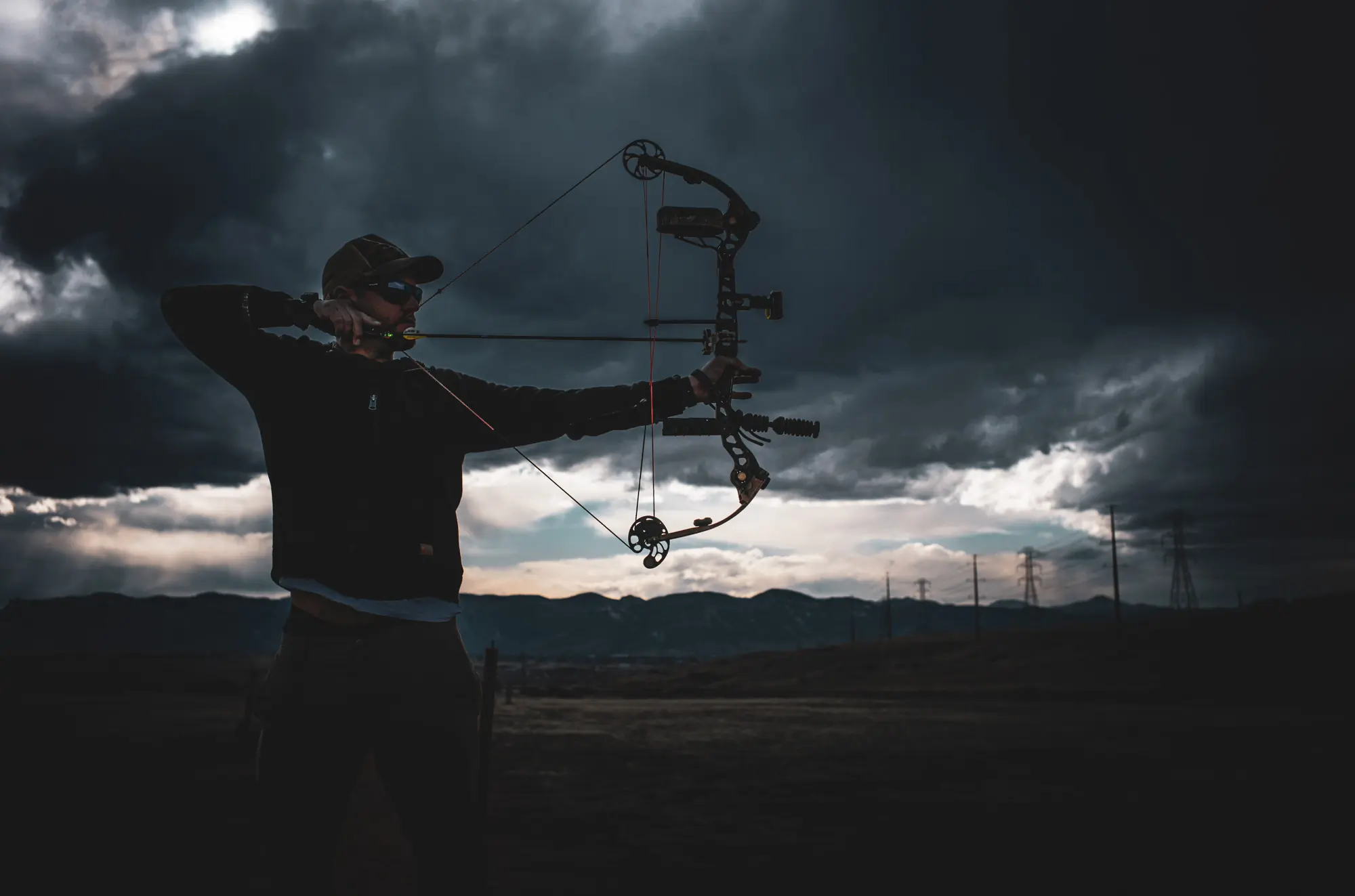 Man shooting bow, shot on Leica M11 camera
