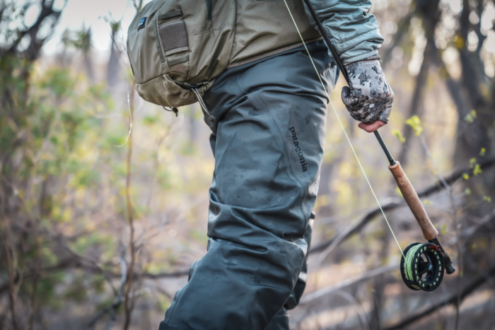 man holding fly fishing rod
