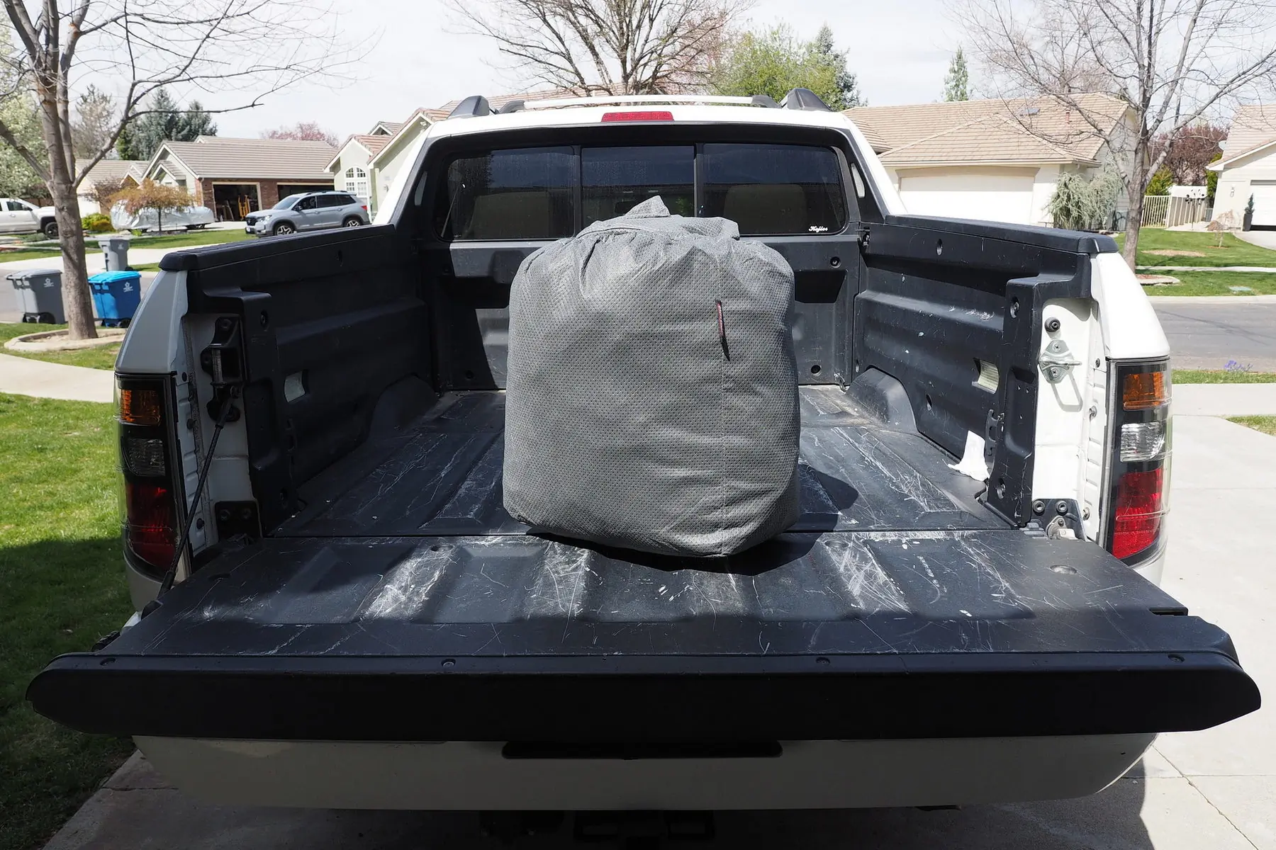 car blanket in a carry case in a truck bed