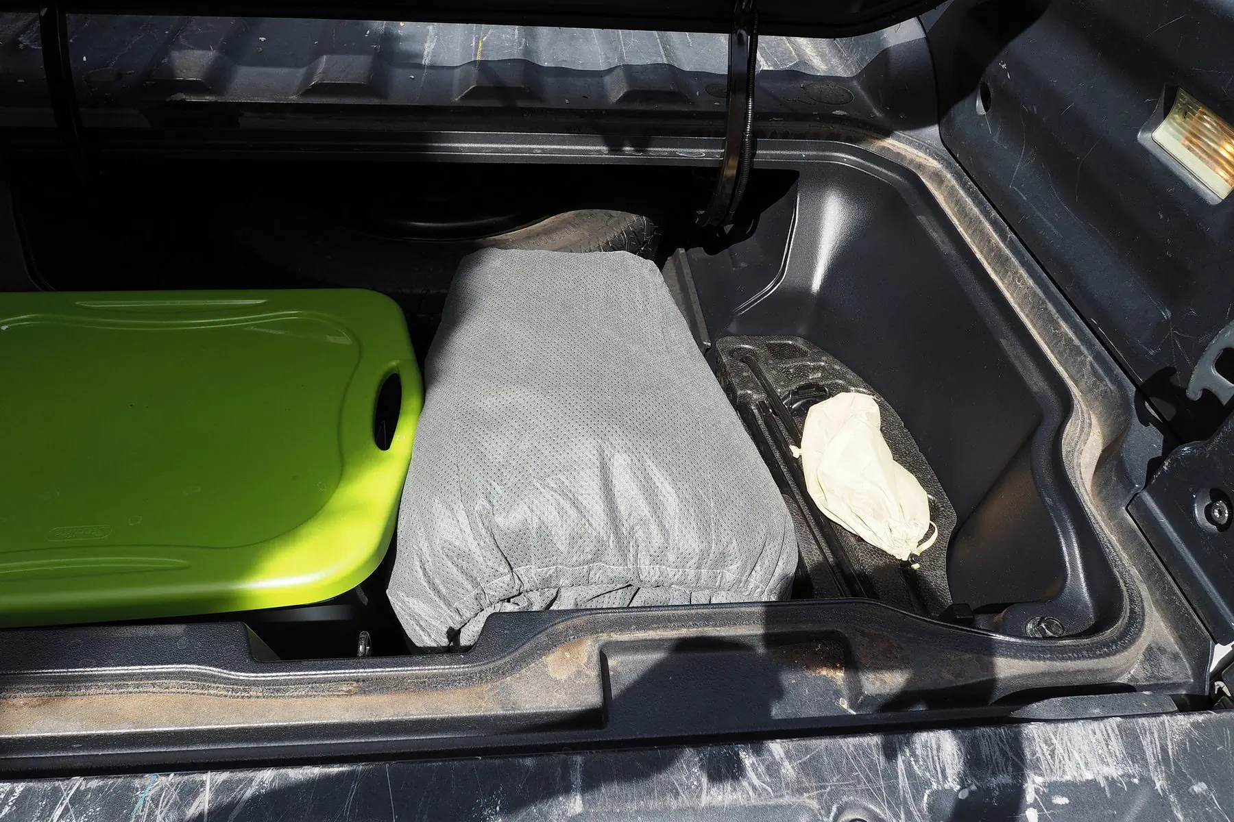 car cover in a carry case in a trunk
