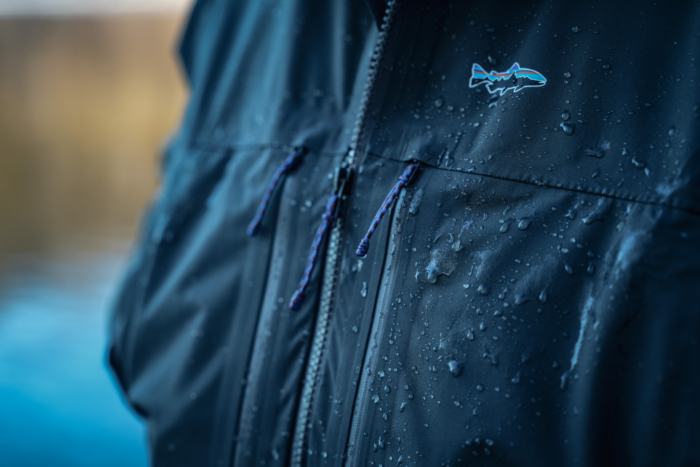 close up of patagonia logo swiftcurrent wading jacket