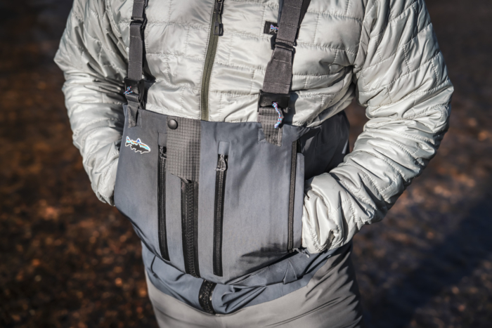 man wearing patagonia swiftcurrent waders