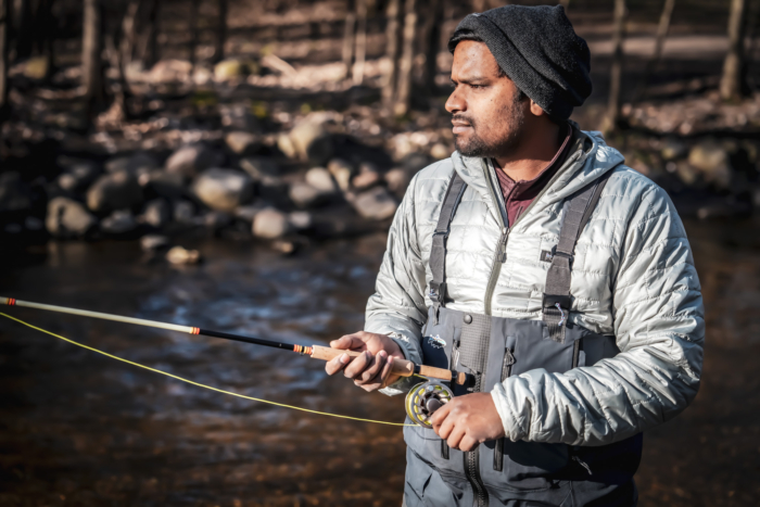 man fly fishing in patagonia gear