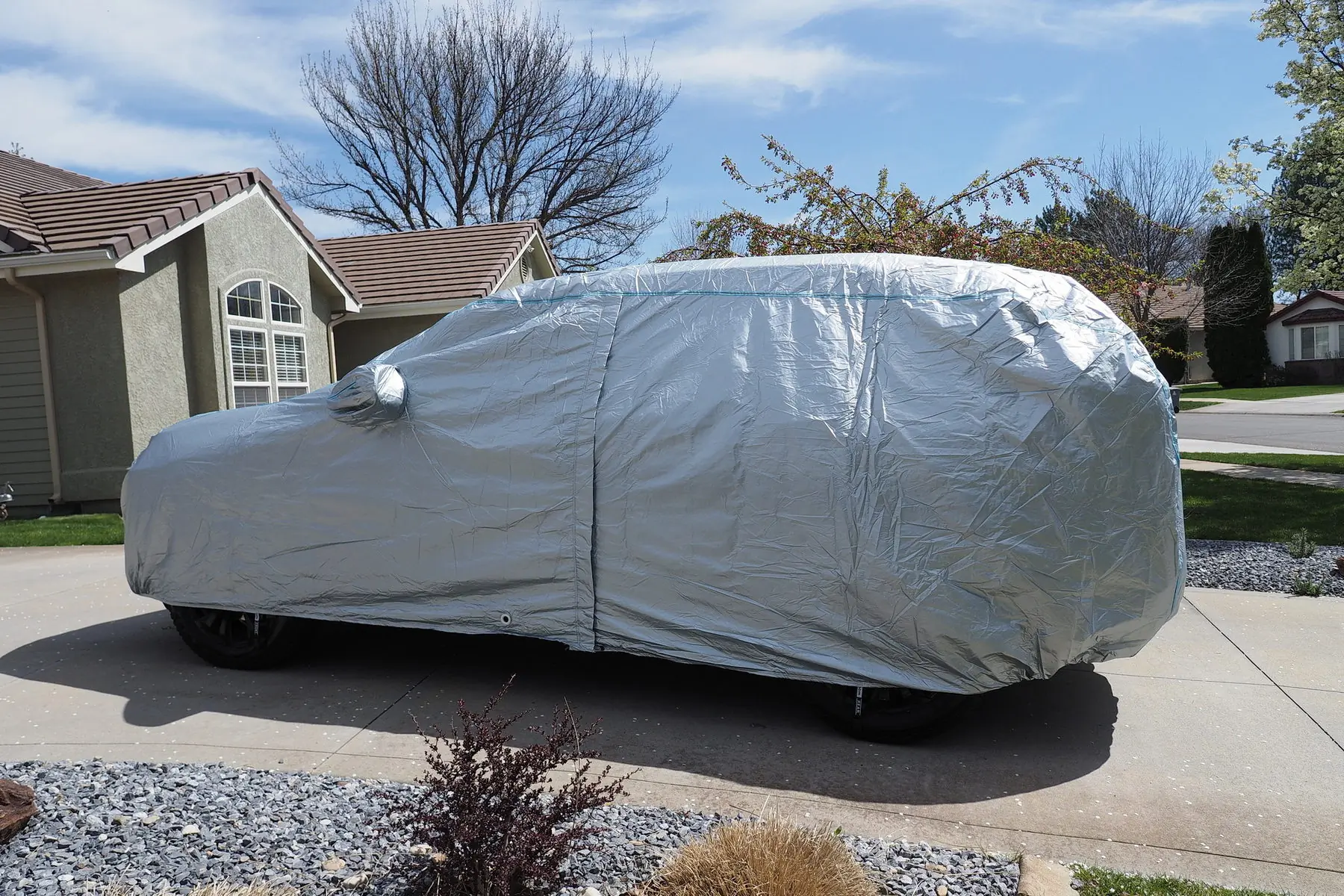 car cover on a vehicle in a driveway