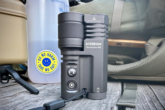 terminator m1 dual head lep led flashlight on table