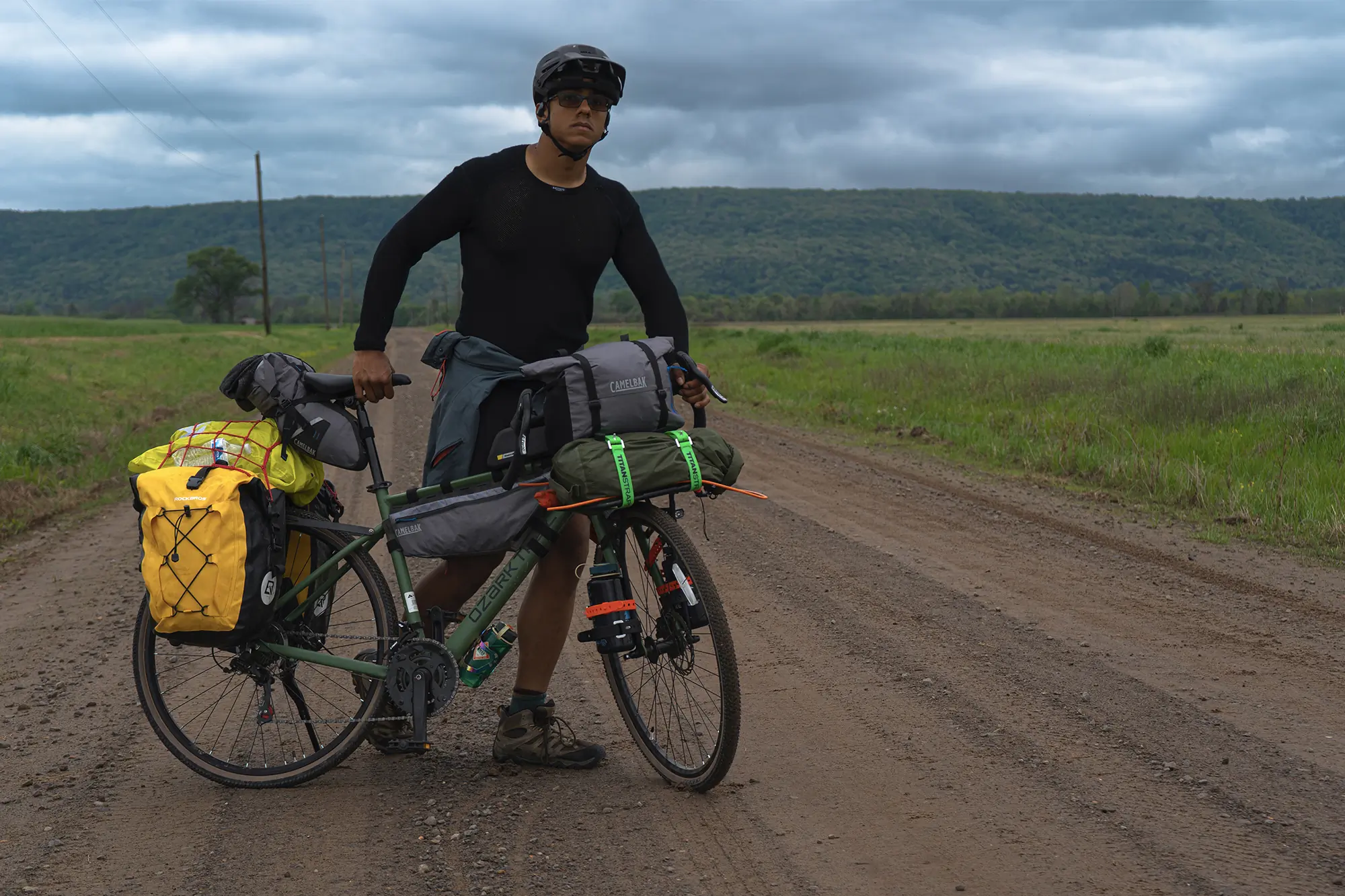 Man tasting new ozark trail g.1 explorer bike on the road