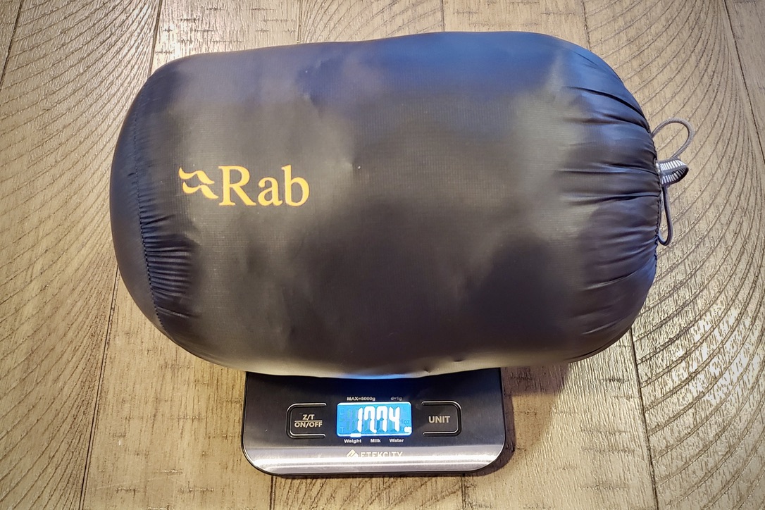 Rab Mythic G down jacket on a digital scale