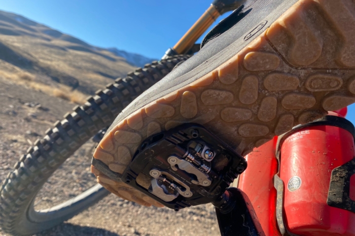 The sole of the Mallet Trail BOA shoes while clipped into a mountain bike pedal