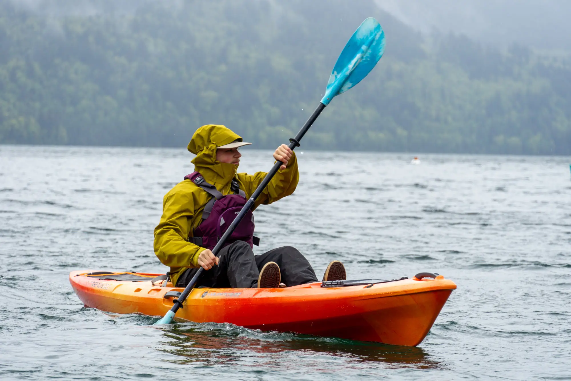 kayaker sitting on a sit-on-top kayak