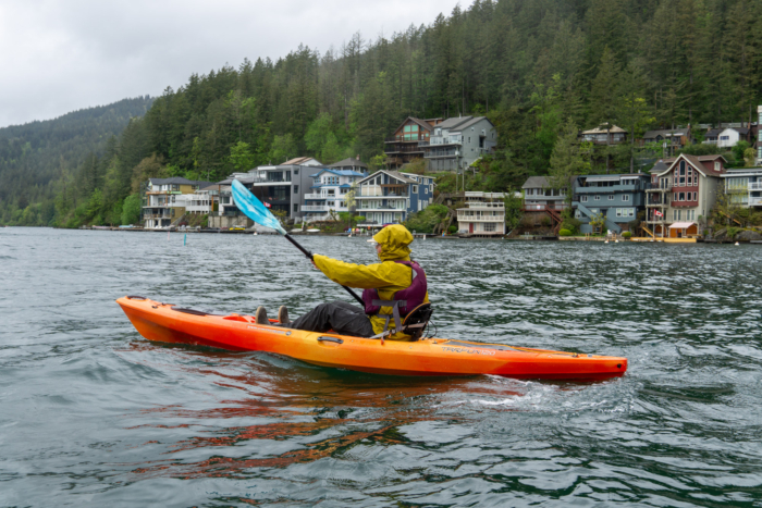 a paddler uses a sit-on-top kayak in a Canadian lake