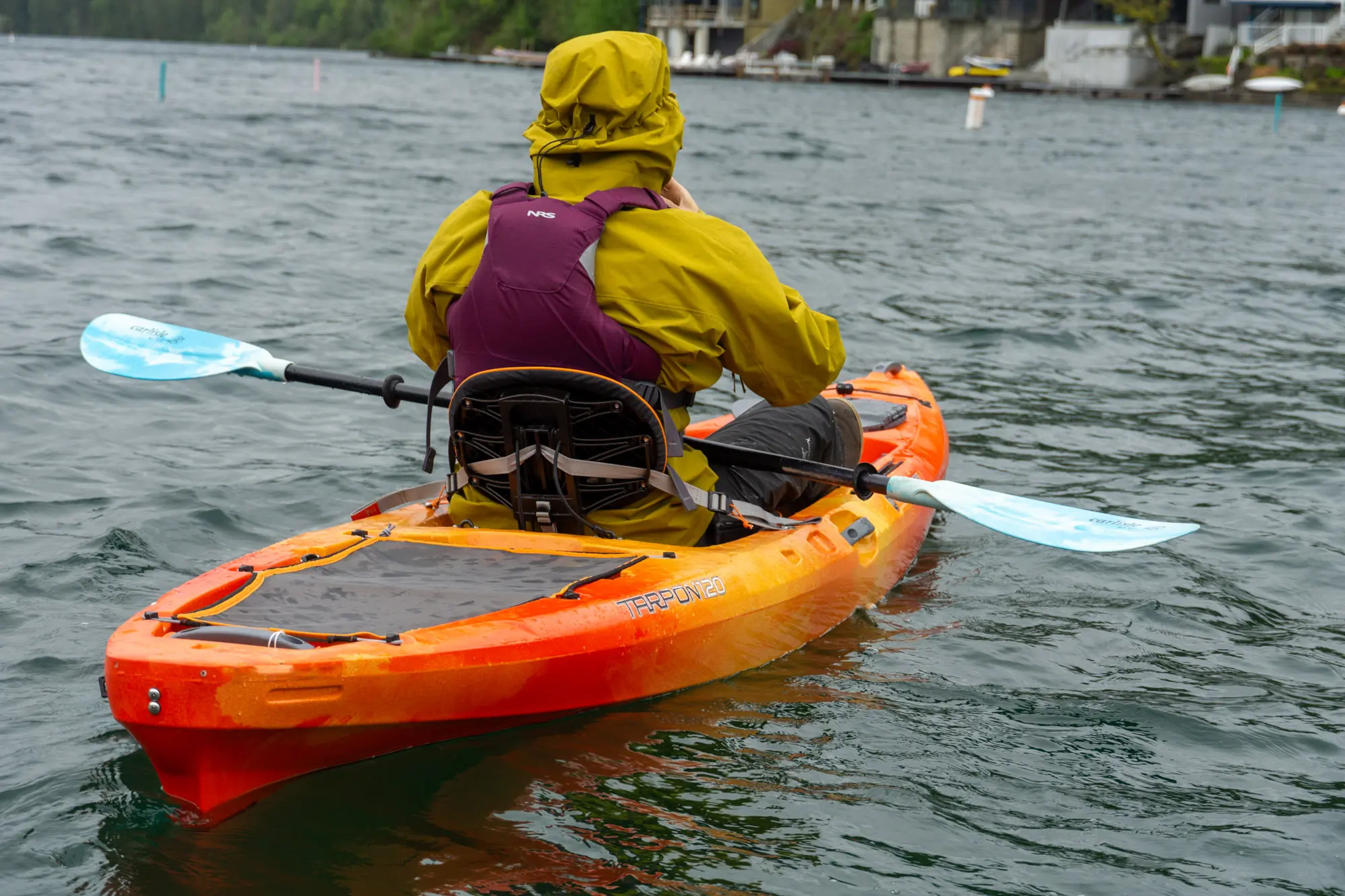 a rear view of a kayak detailing the seat and the adjustability straps