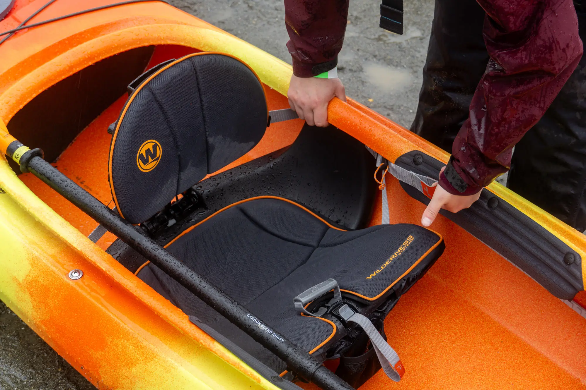 front view of a Wilderness systems kayak seat and adjusting the fore and aft