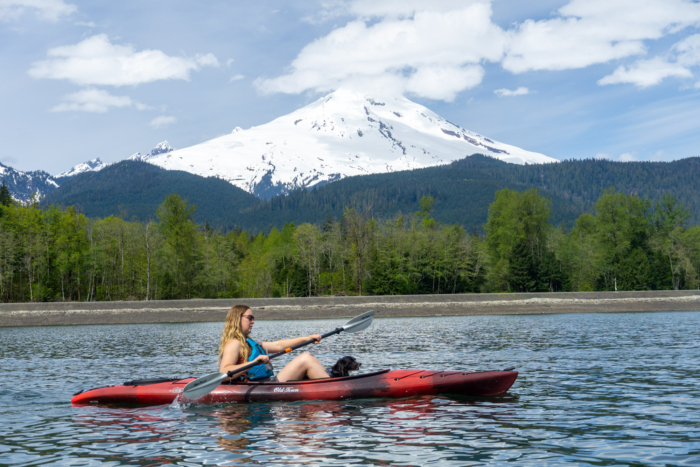 a paddler in the Old Town Loon paddles in front of the volcano Kulshan