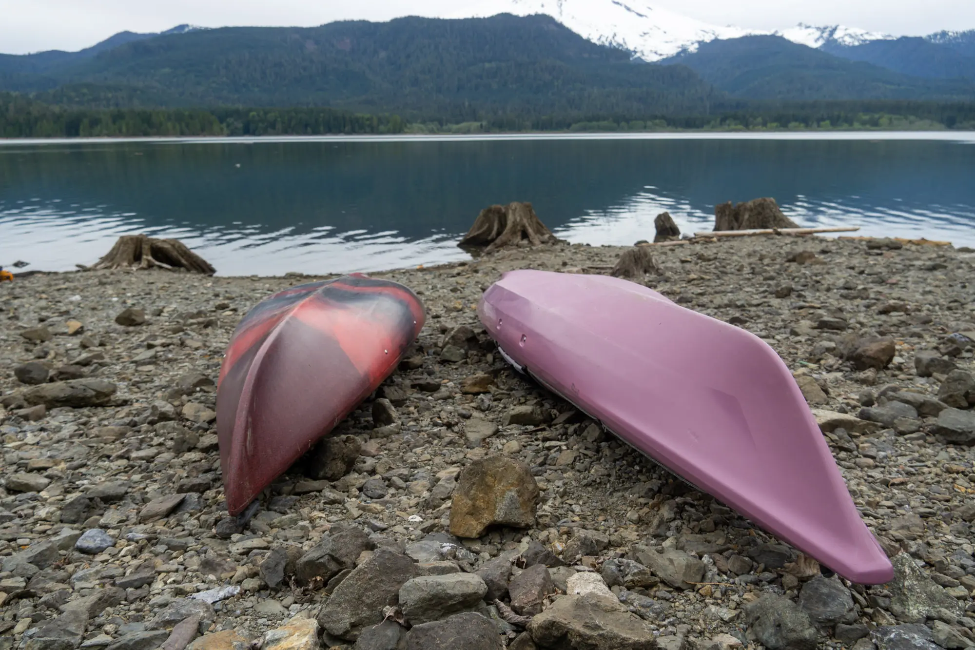 two upside down kayaks show the different hull shapes that effect their paddling