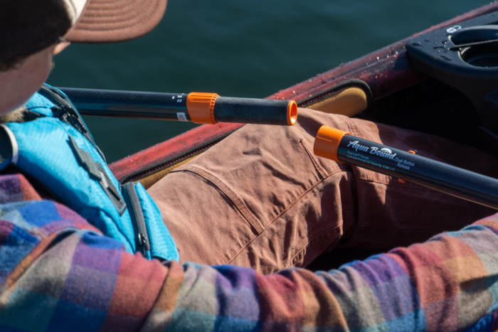 A kayaker demonstrates the Posi-Lok ferrule found on Aqua Bound paddles