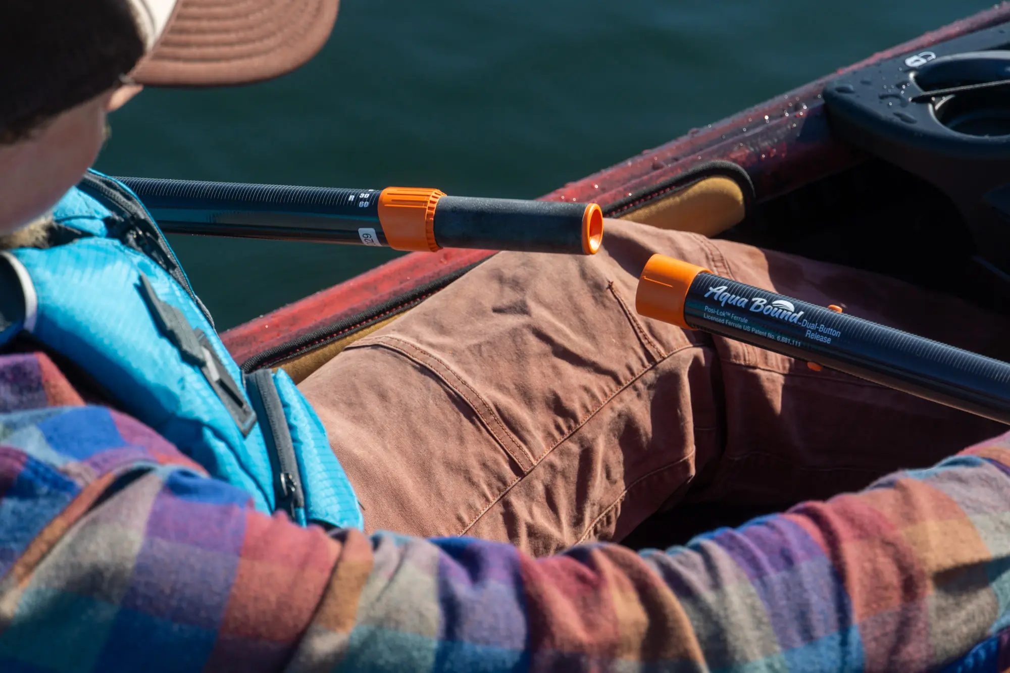 A kayaker demonstrates the Posi-Lok ferrule found on Aqua Bound paddles