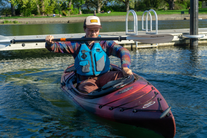 a kayak tester rocks the old town loon back and forth to challenge stability