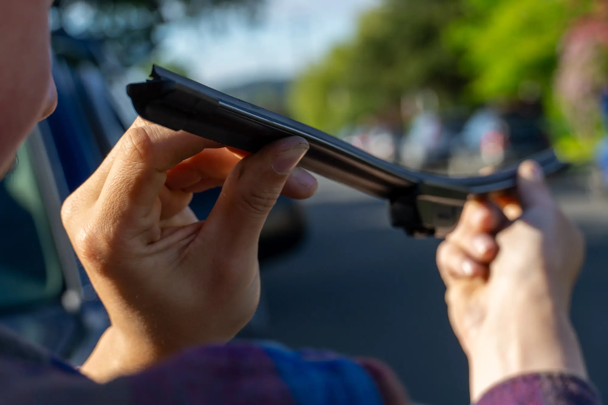 looking down the length of a wiper blade, detailing the curvature