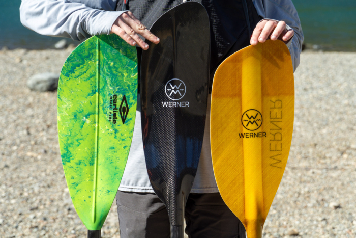 Three kayak paddles in a row show the different in blade size and shape