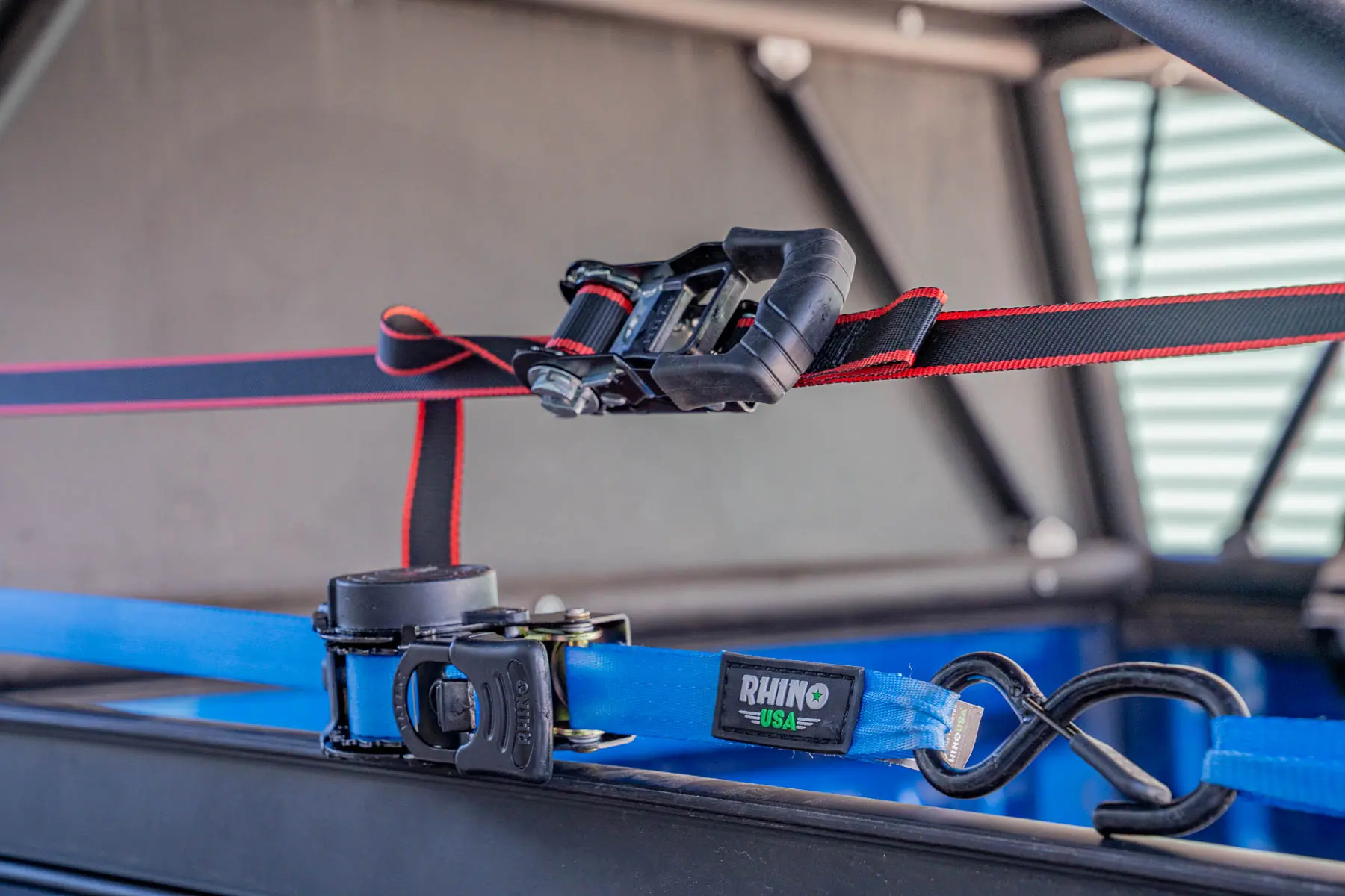 two ratchet straps held taut 