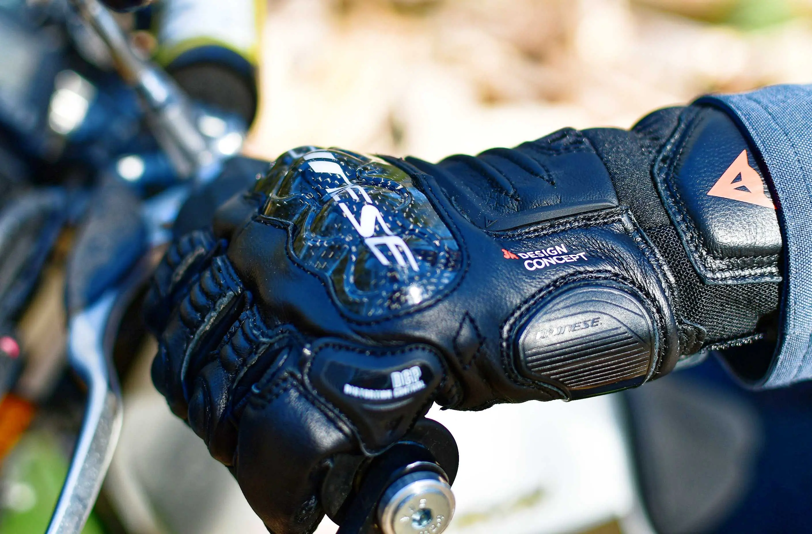 hand gripping a moto bar