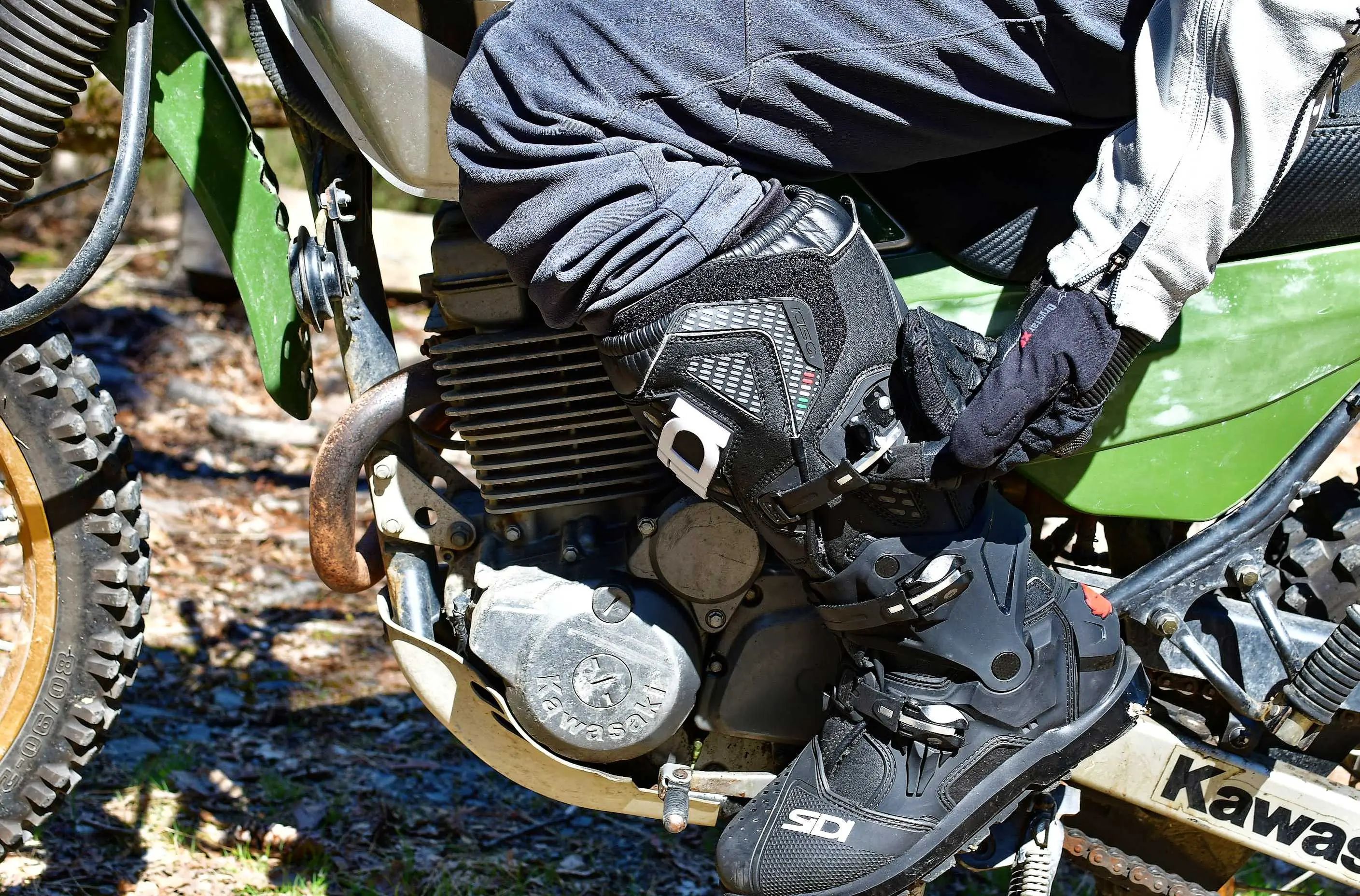 clipping a buckle on a motorcycle boot