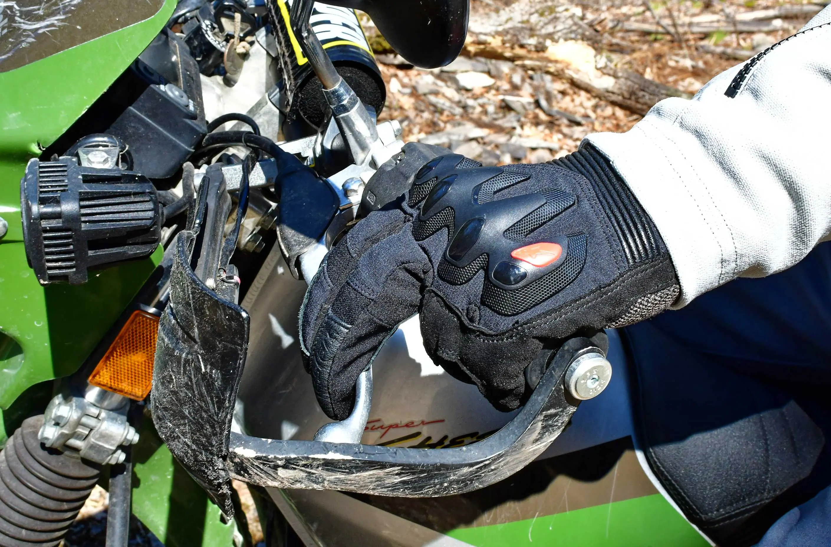 fingers on a motorcyclist pulling back on a brake