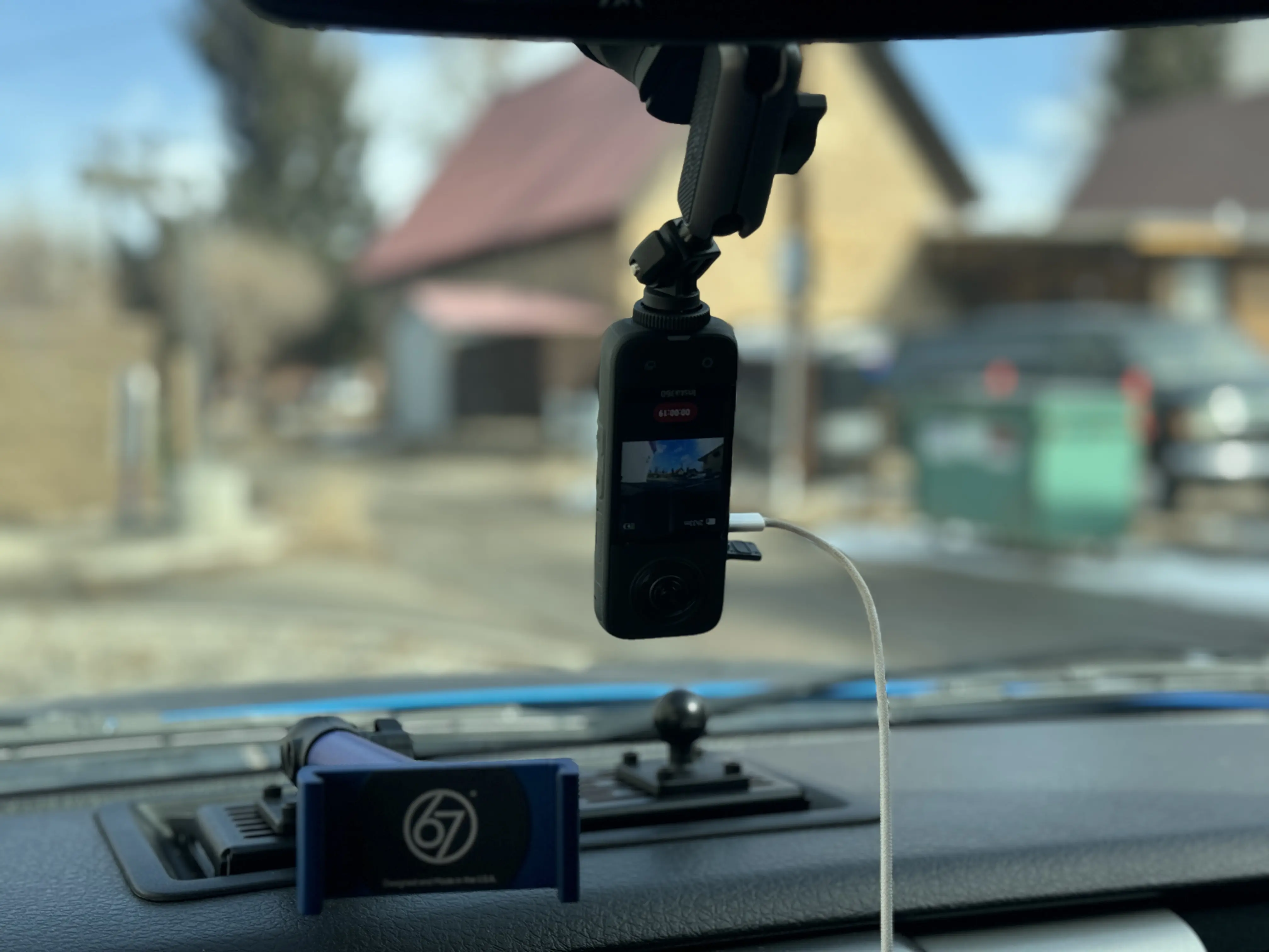 recording view on screen of dash cam mounted inside windshield 