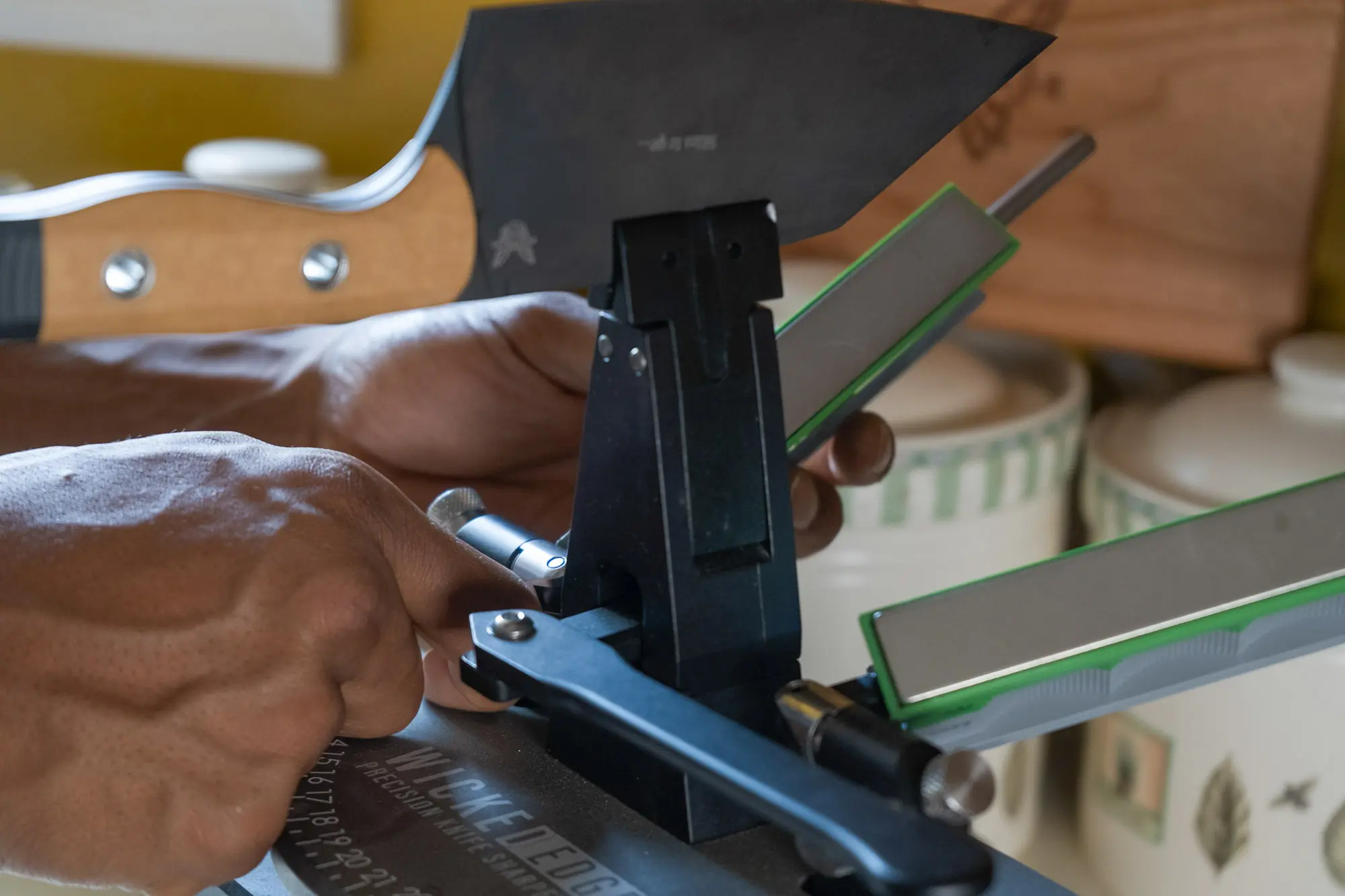 A larger cleaver is held in the Wicked Edge Gen 4 Pro