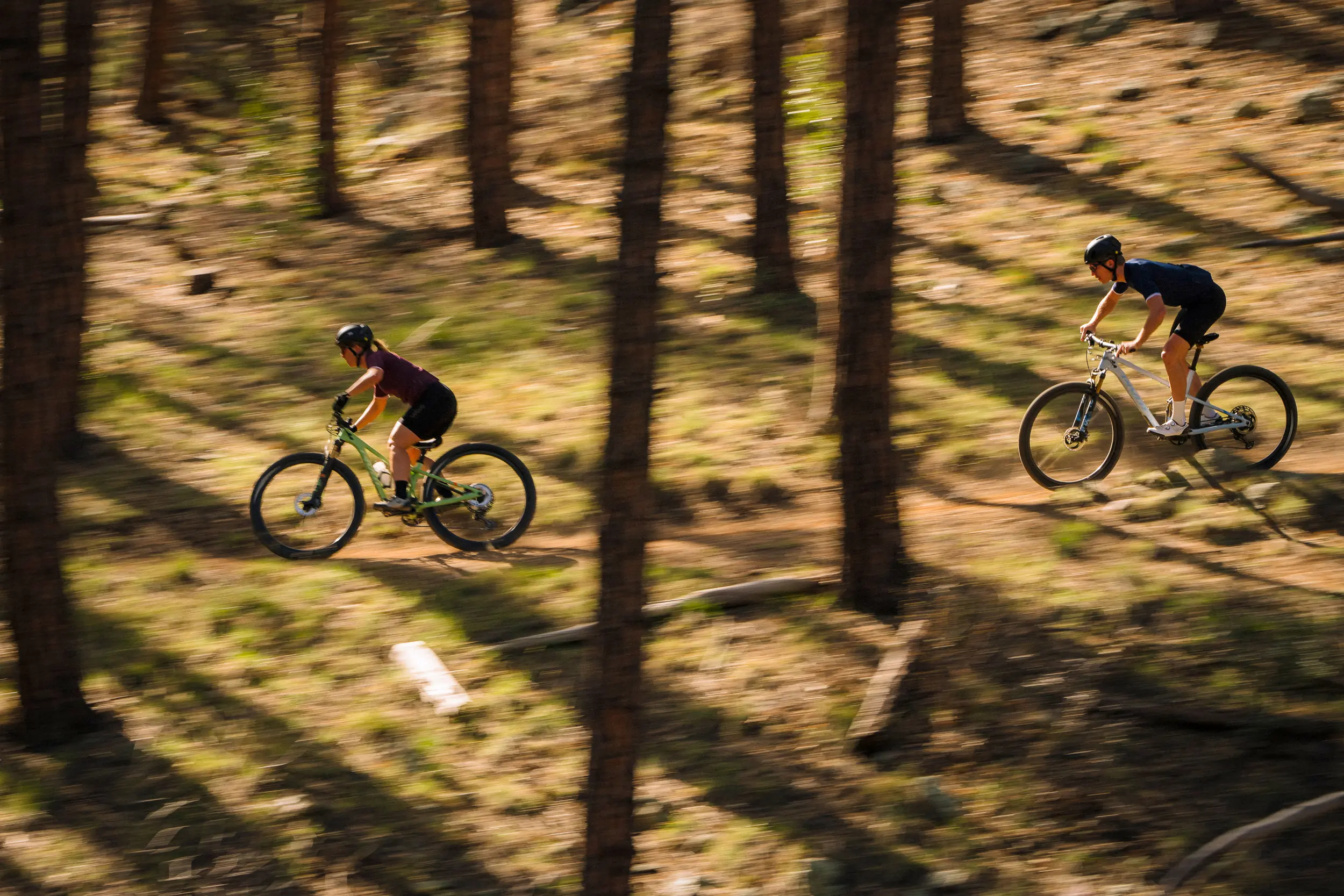 Two riders at speed on 2023 Pivot Mach 4 SLs