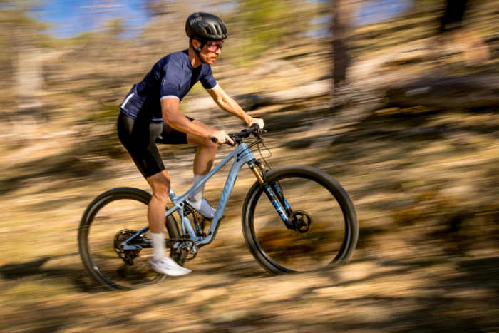 Man riding a 2023 Pivot Mach 4 SL