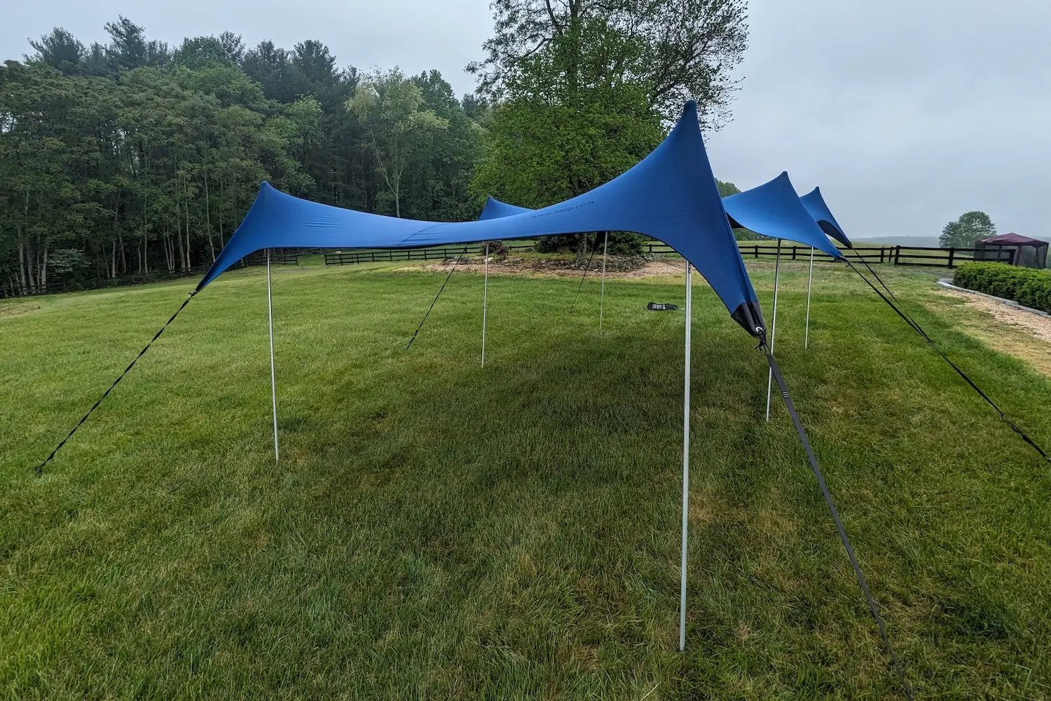 The Neso Party Tent set up on a large grass lawn