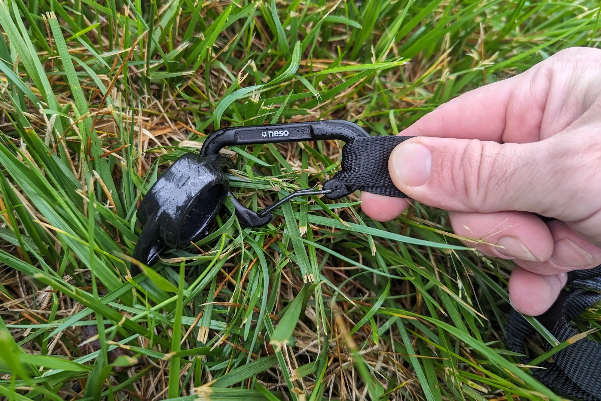 The Neso Party Tent screw-in stakes and carabiner anchor clips