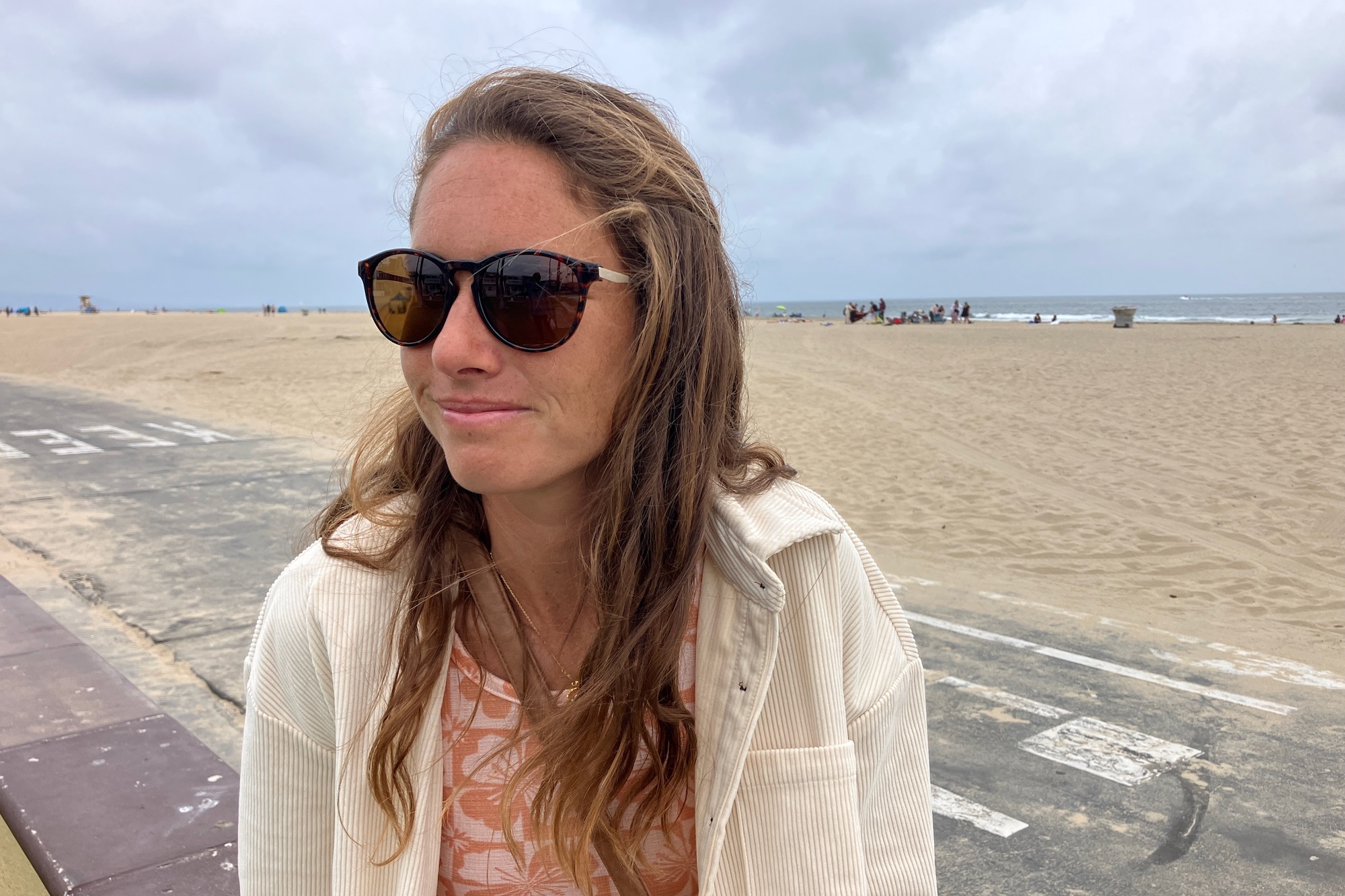 Wearing the Smith Wander women's sunglasses on an overcast day at the beach in Hawaii