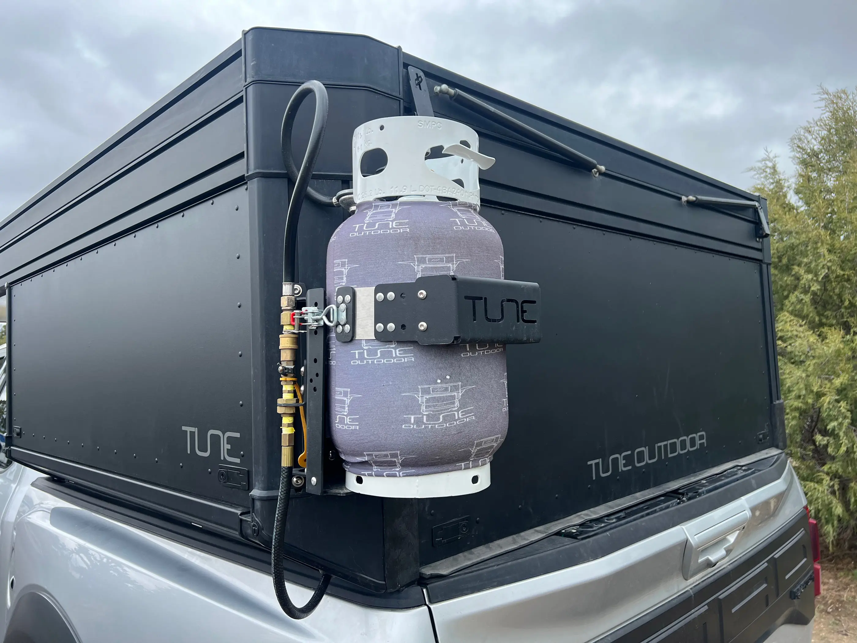 Propane tank carrier on the TUNE M1 camper
