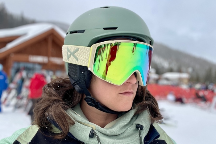 woman wearing anon merak wavecel helmet on snow