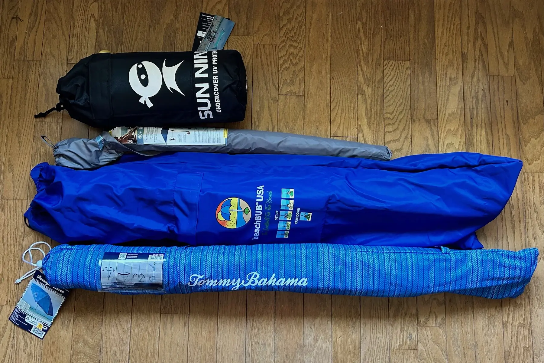 beach umbrella comparison photo to show differences in packed size