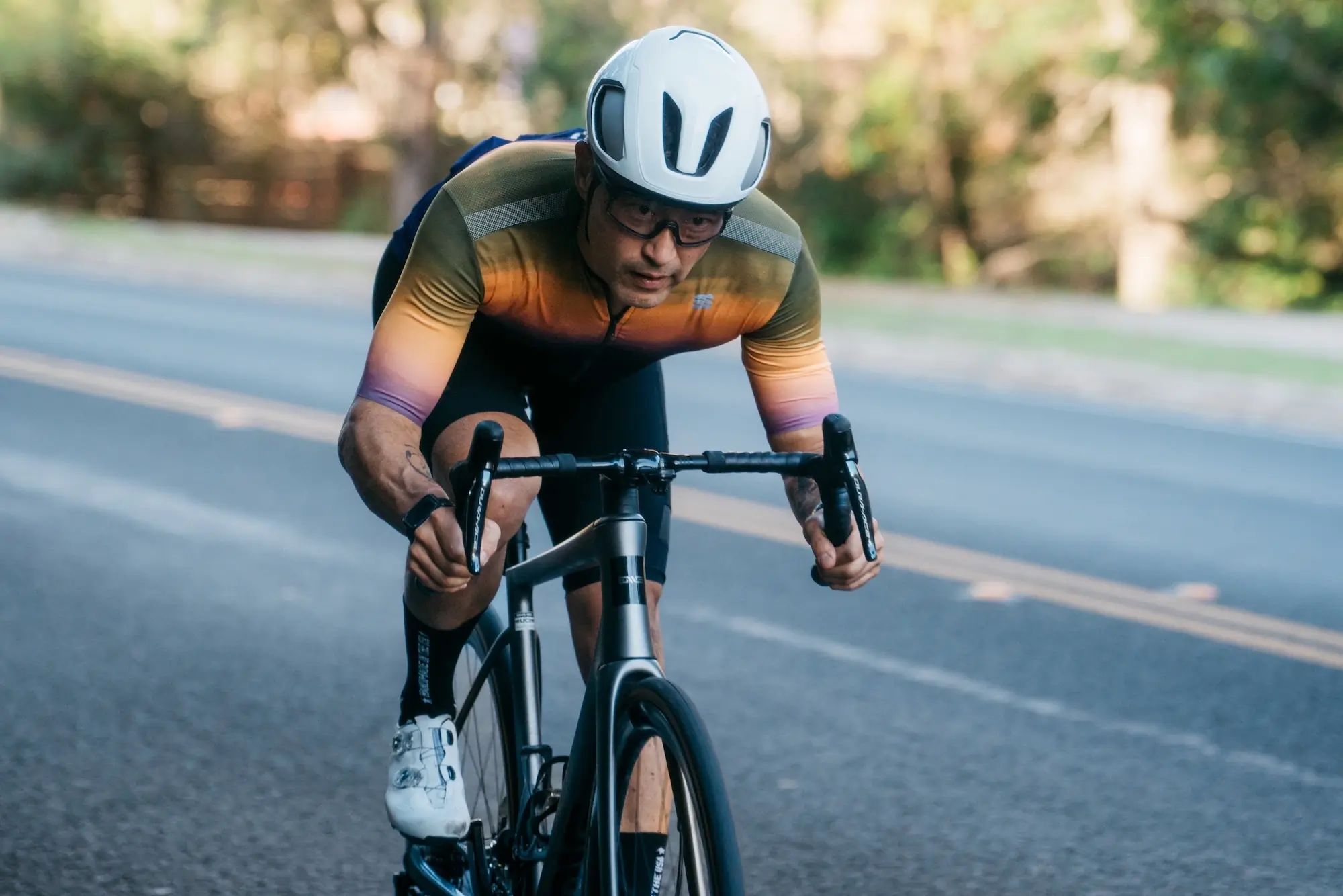 Cycling in an aggressive position while wearing bib shorts