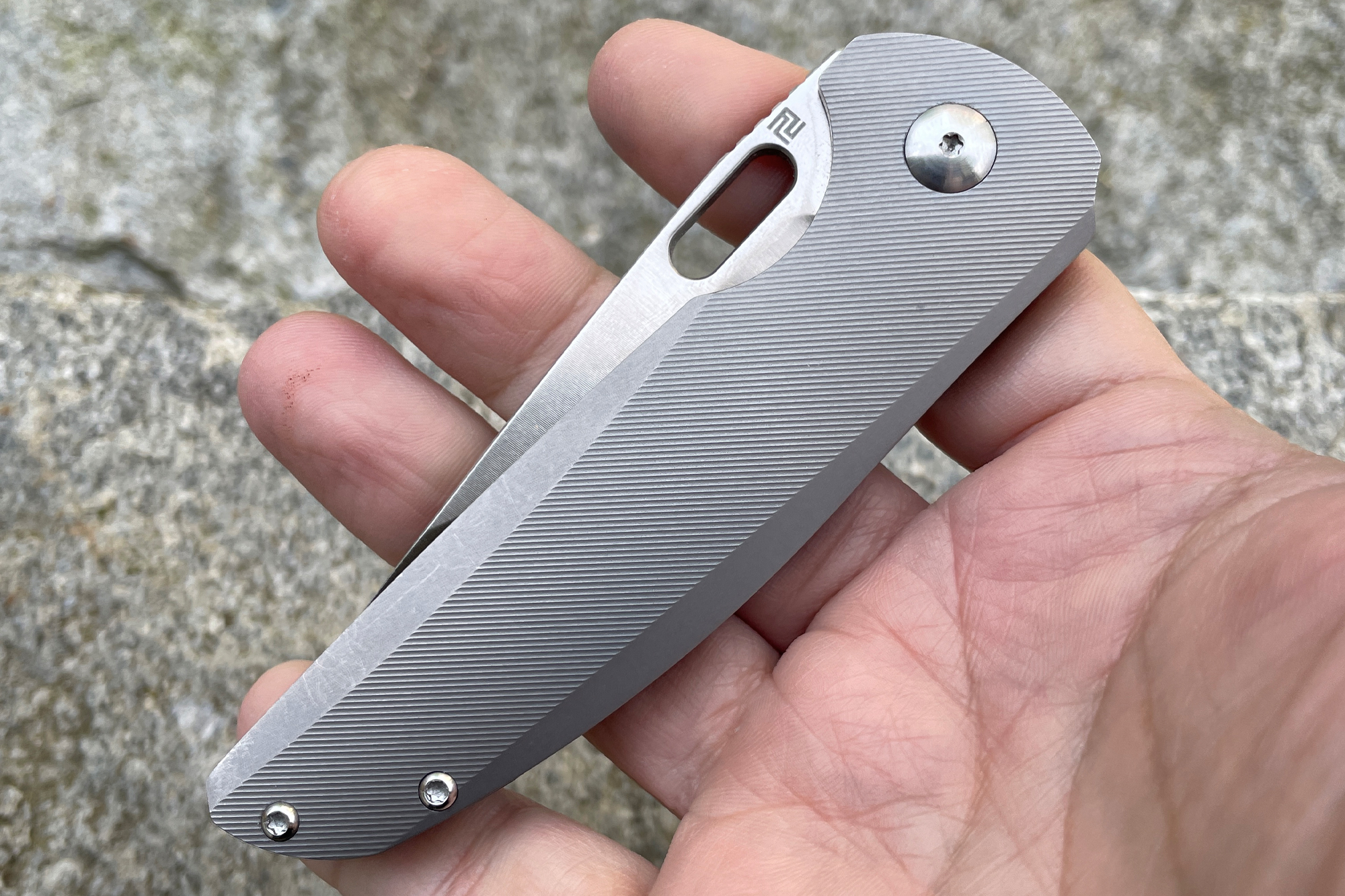 holding artisan cutlery satyr knife in a hand